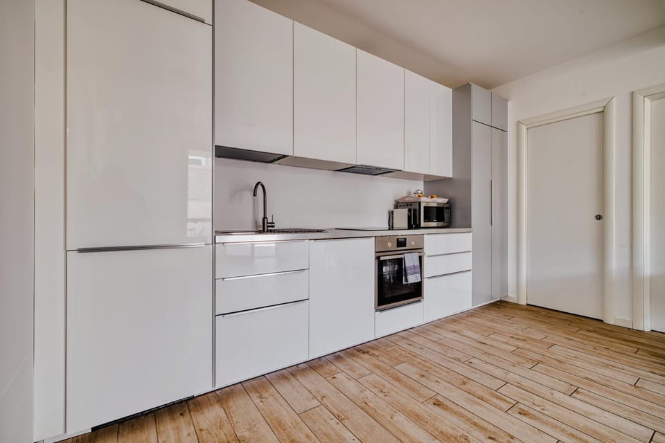 Kitchen or kitchenette, dishwasher, oven, stove