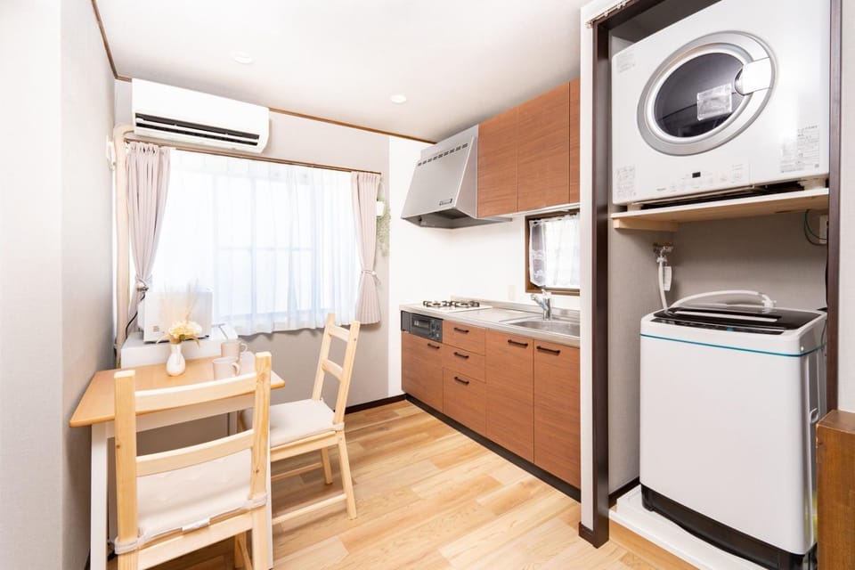Kitchen or kitchenette, Living room, Dining area, stove, washing machine, dryer, air conditioner