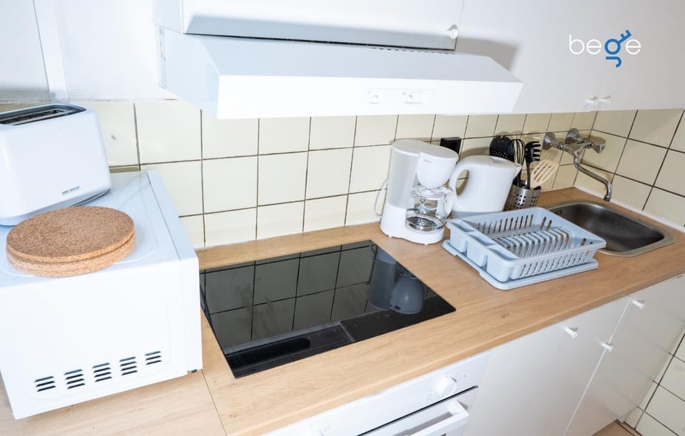Kitchen or kitchenette, stove, toaster
