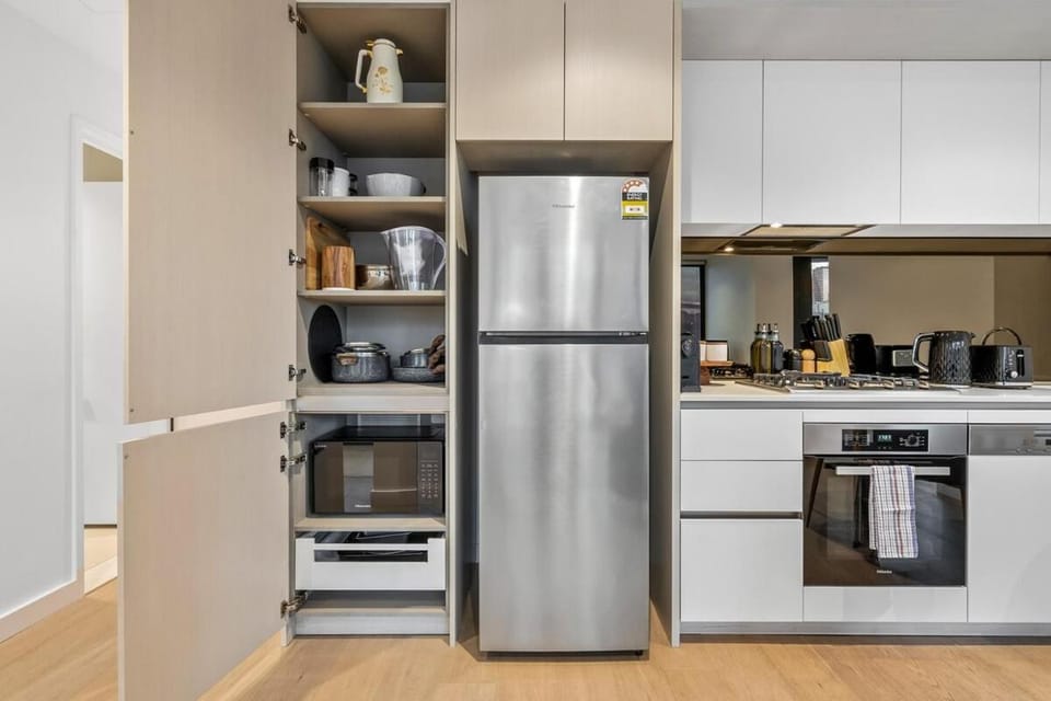 Kitchen or kitchenette, microwave, oven, stove