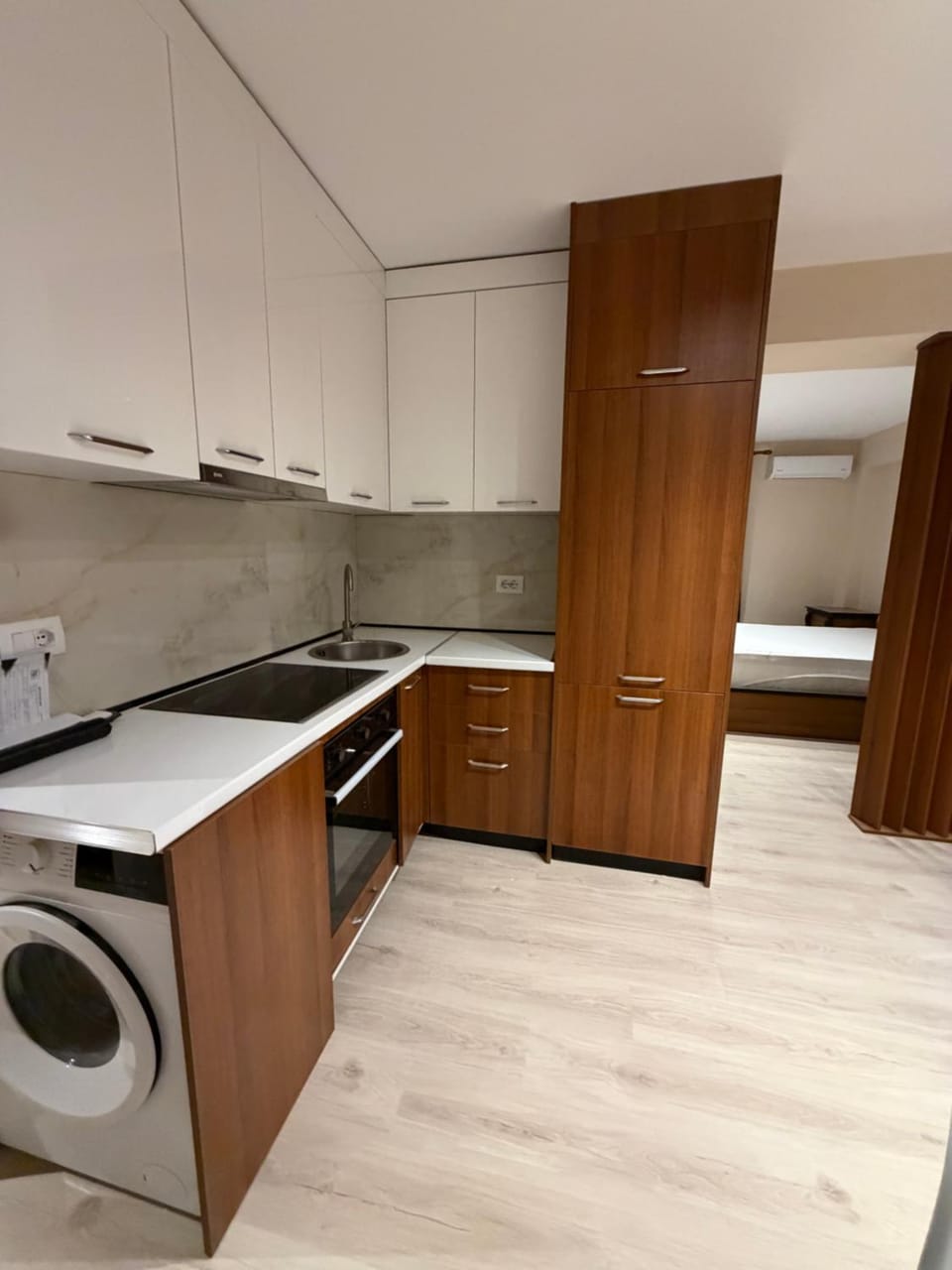 Kitchen or kitchenette, washing machine