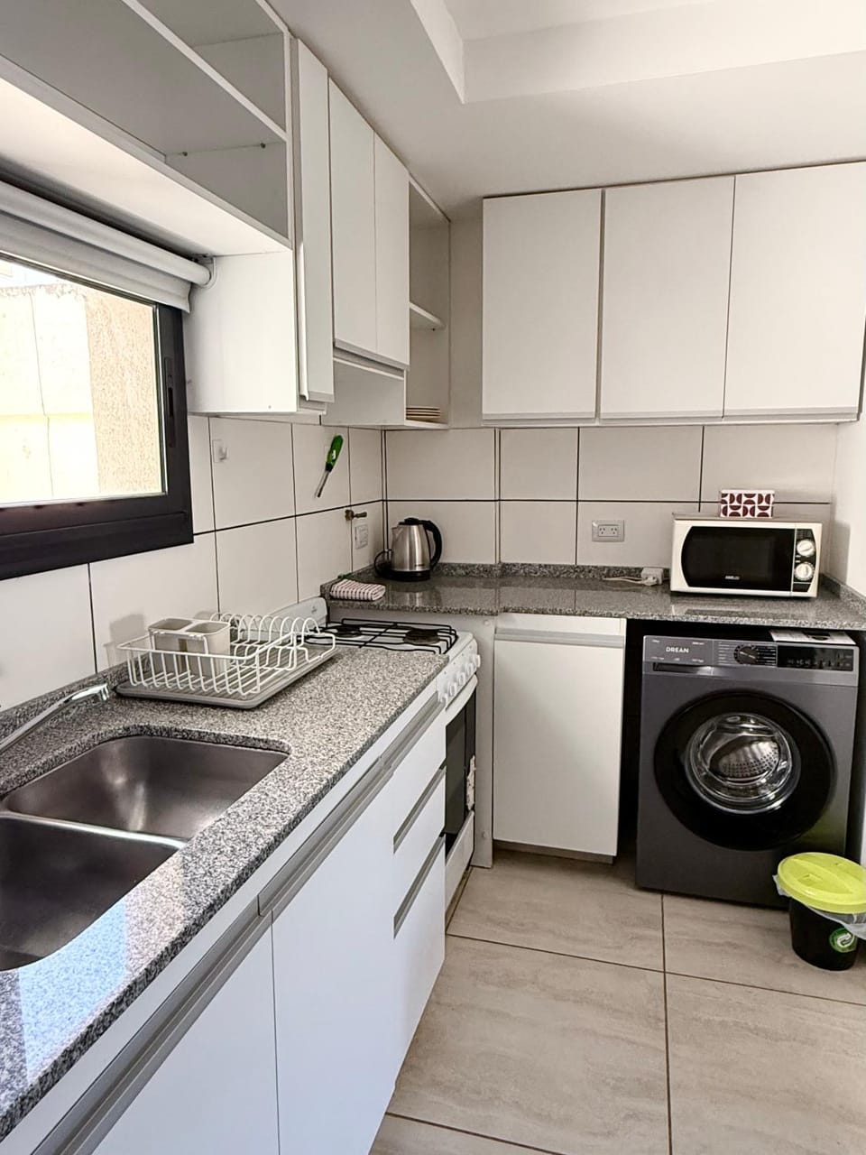 Kitchen or kitchenette, washing machine