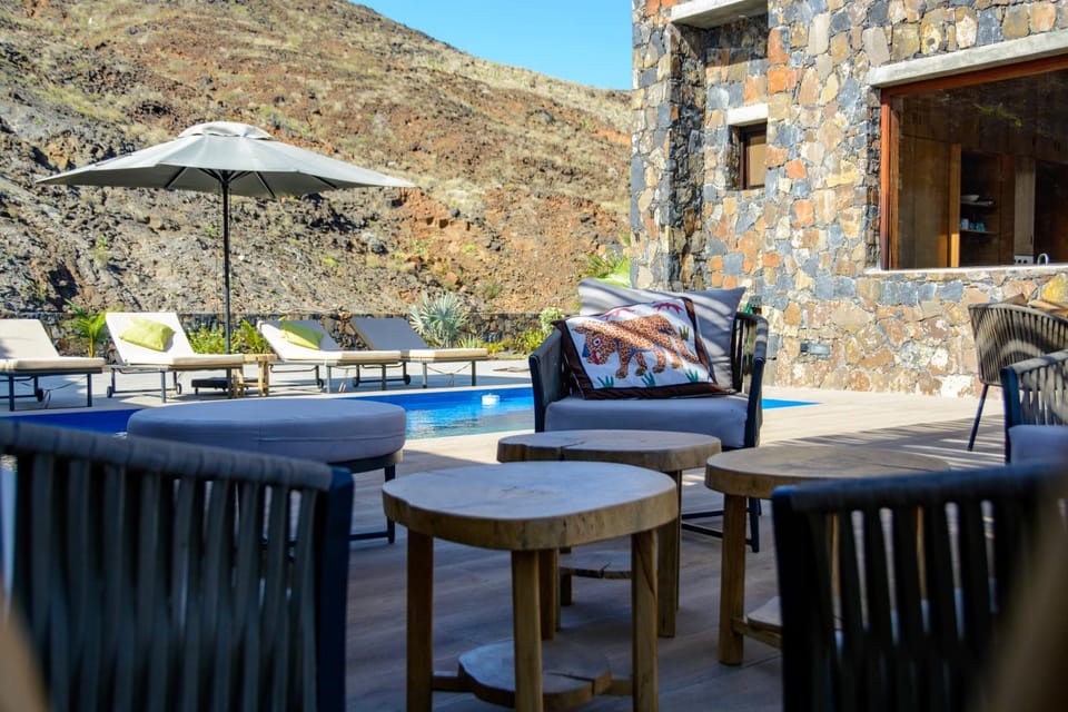 Property building, Patio, Spring, Natural landscape, View (from property/room), Balcony/Terrace, Living room, Seating area, Mountain view