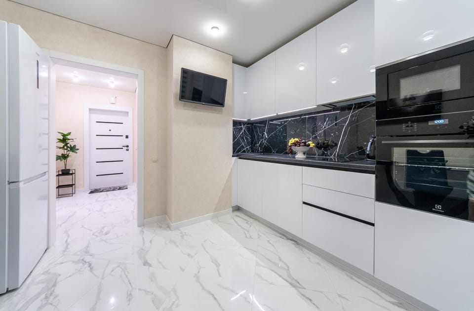Kitchen or kitchenette, dishwasher, oven, stove