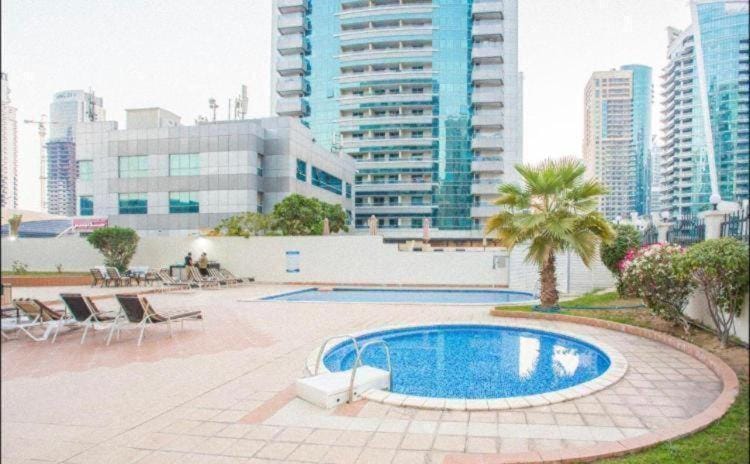 Property building, Day, Pool view, Swimming pool, sunbed