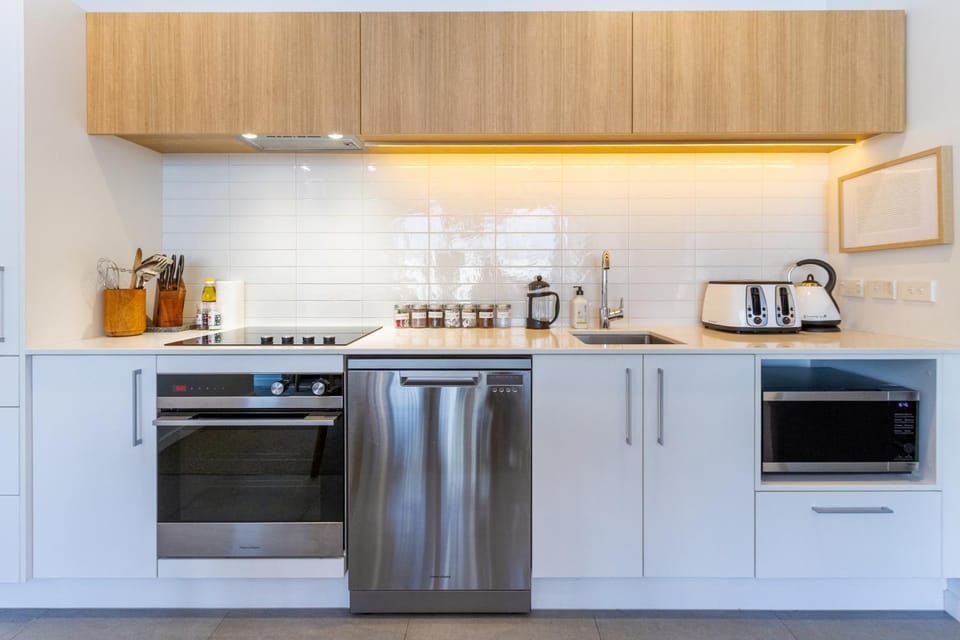 Kitchen or kitchenette, dishwasher, oven, stove, toaster