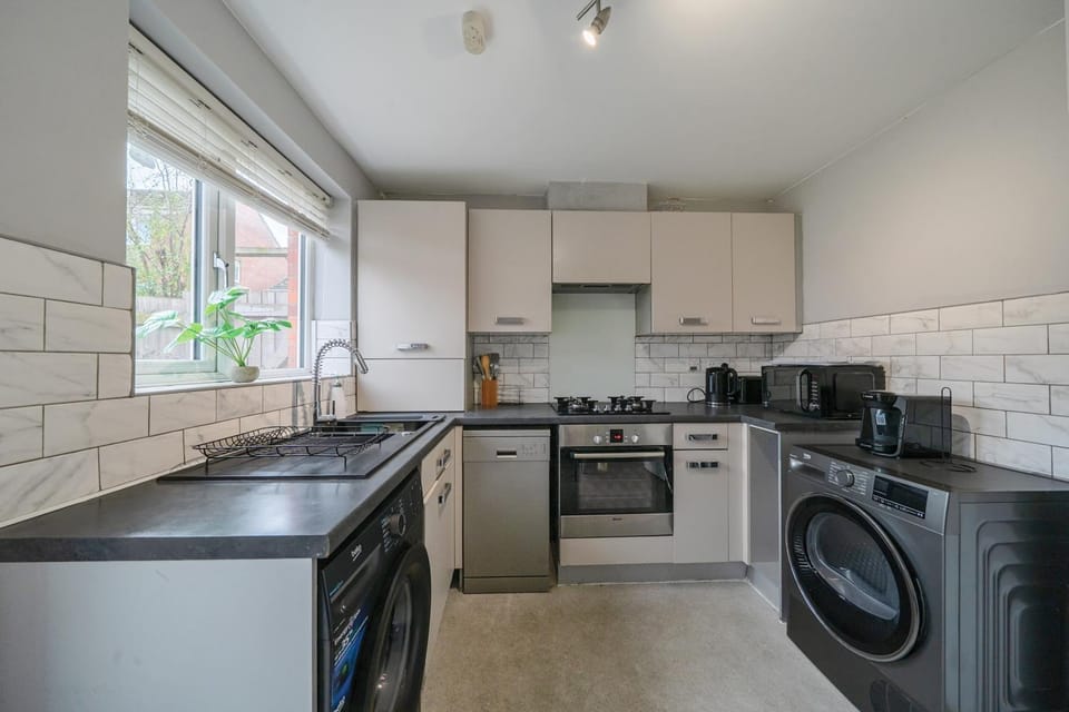 Kitchen or kitchenette, dishwasher, oven, stove, washing machine, dryer