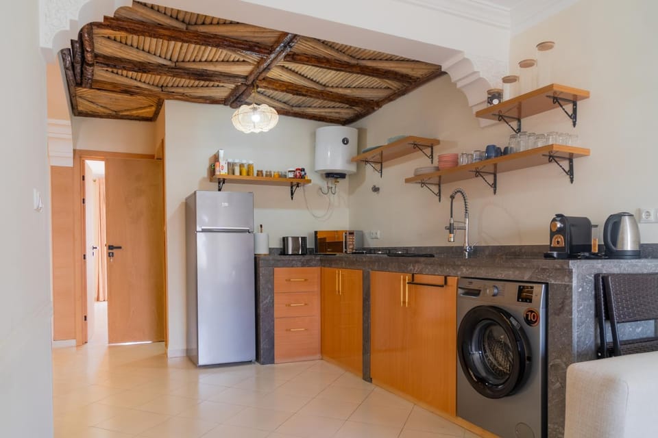 Kitchen or kitchenette, oven, stove, washing machine