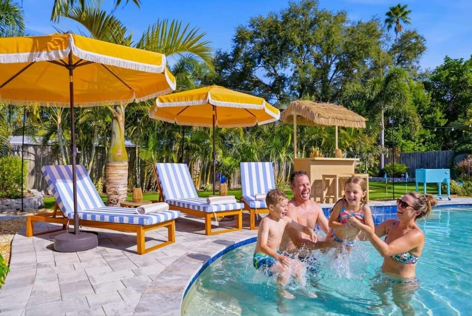 Resort Style Backyard Pool Hot Tub Games House in Bay Pines