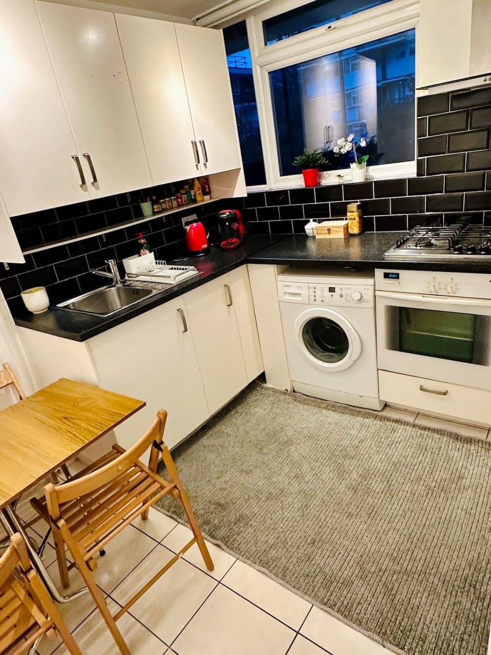 Kitchen or kitchenette, oven, stove, toaster, washing machine