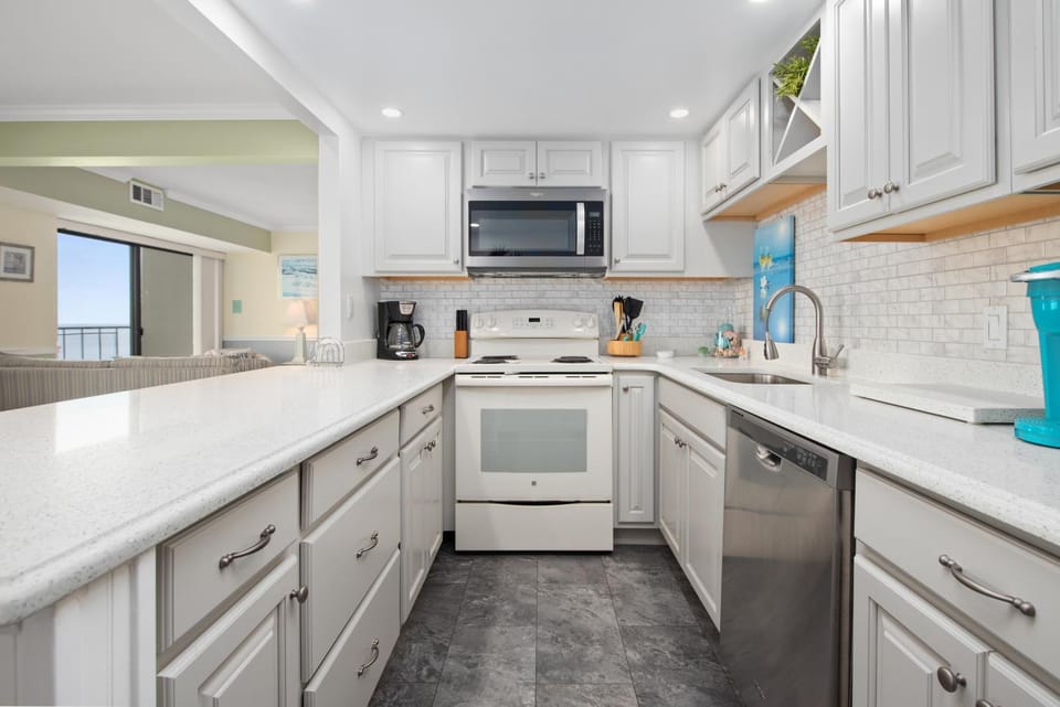 Kitchen or kitchenette, dishwasher, oven, stove, toaster