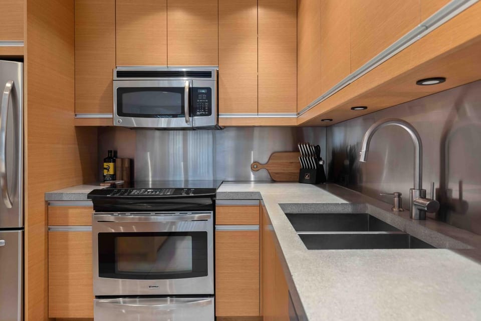 Kitchen or kitchenette, dishwasher, microwave, oven, stove