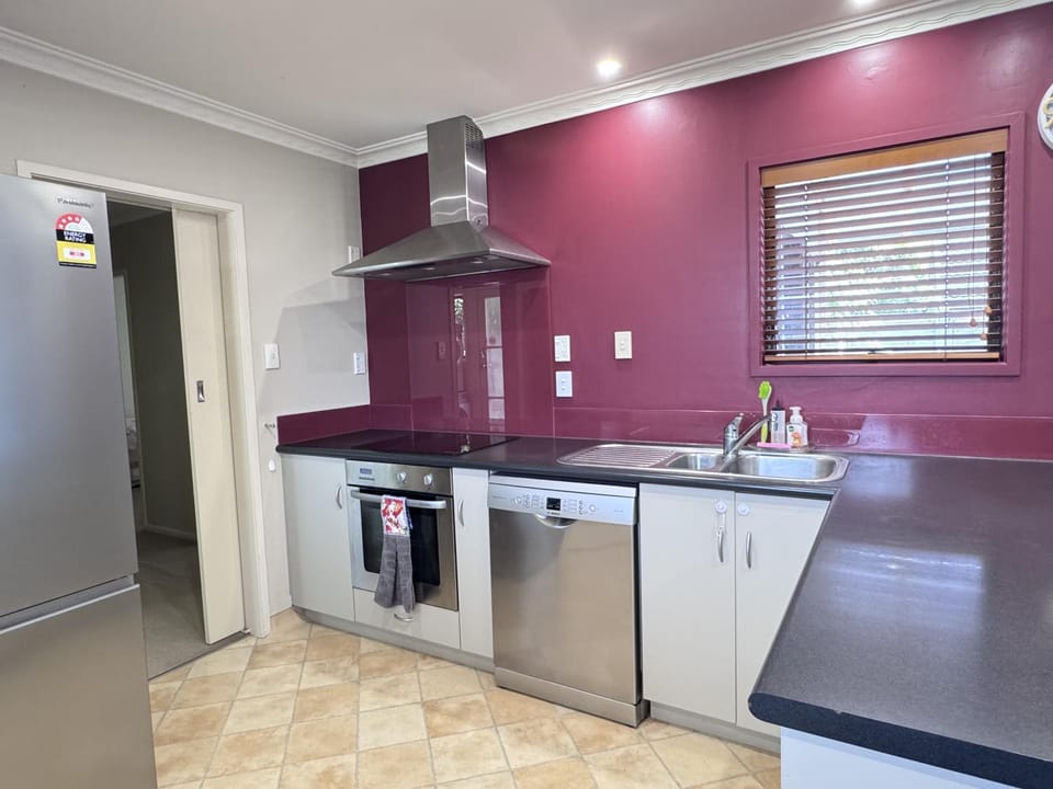 Kitchen or kitchenette, dishwasher, oven, stove
