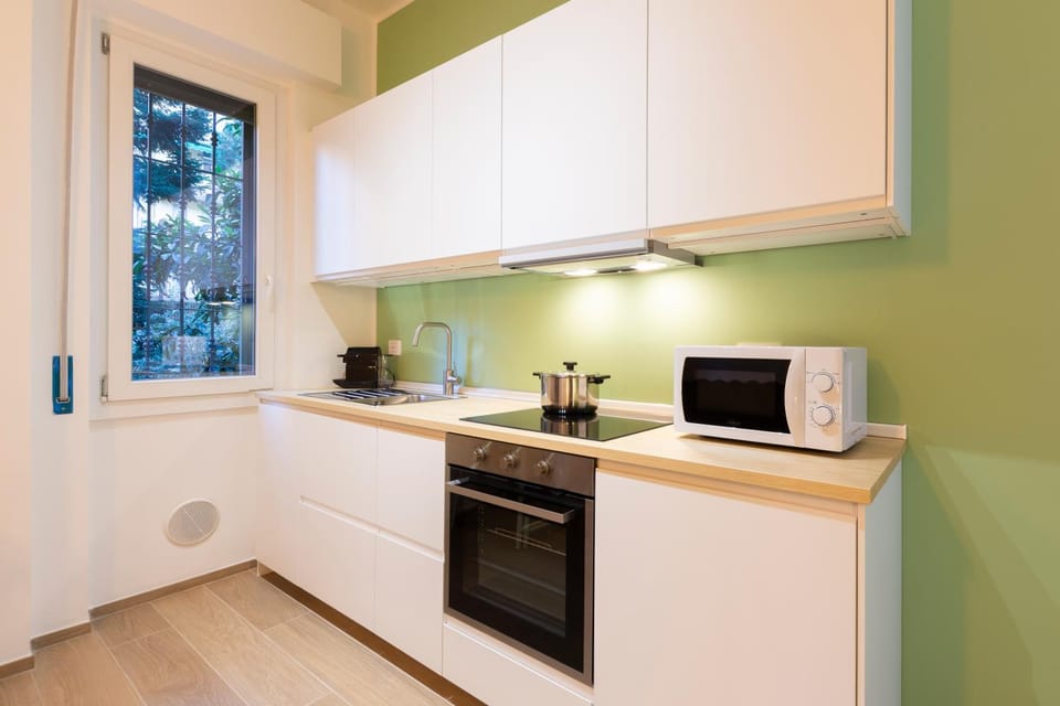 Kitchen or kitchenette, dishwasher, oven, stove