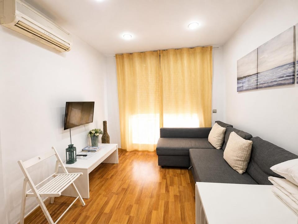 Bed, TV and multimedia, Living room, Seating area, air conditioner
