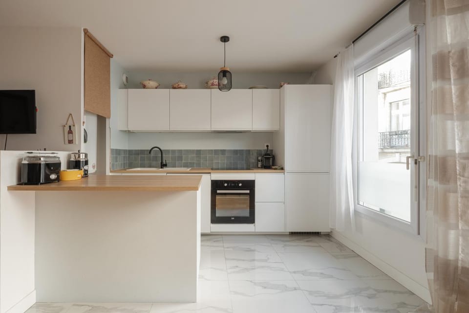Kitchen or kitchenette, dishwasher, oven, stove, toaster