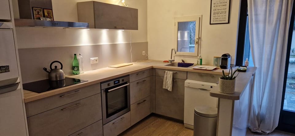 Kitchen or kitchenette, dishwasher, oven, stove