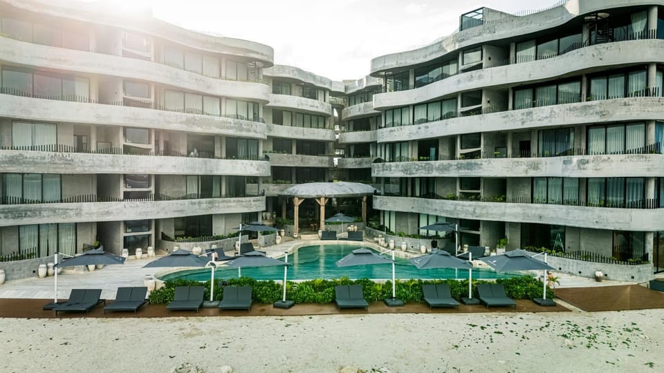 Property building, Day, Pool view, Swimming pool, sunbed