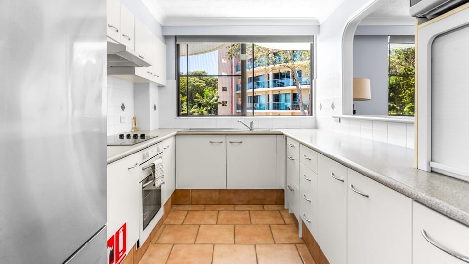 Kitchen or kitchenette, dishwasher, oven, stove