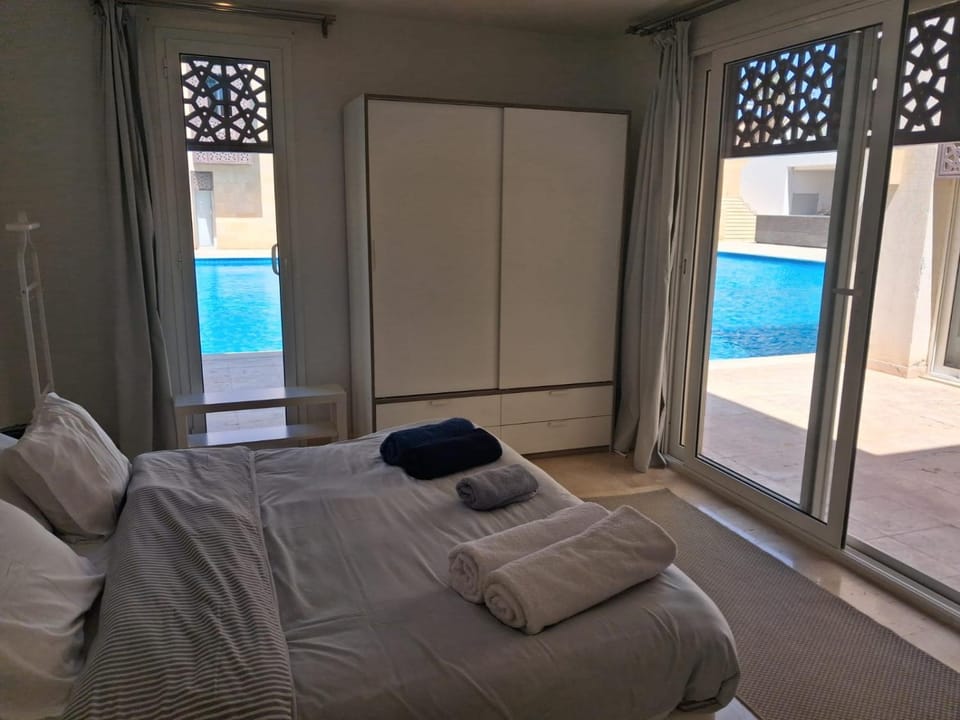 Bed, View (from property/room), Bedroom, Pool view, towels, wardrobe