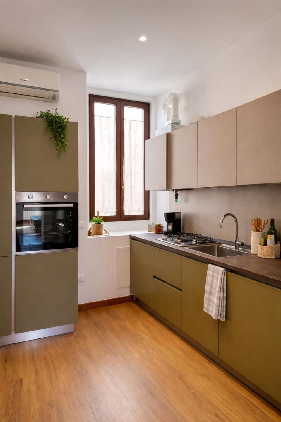 Kitchen or kitchenette, dishwasher, oven, stove