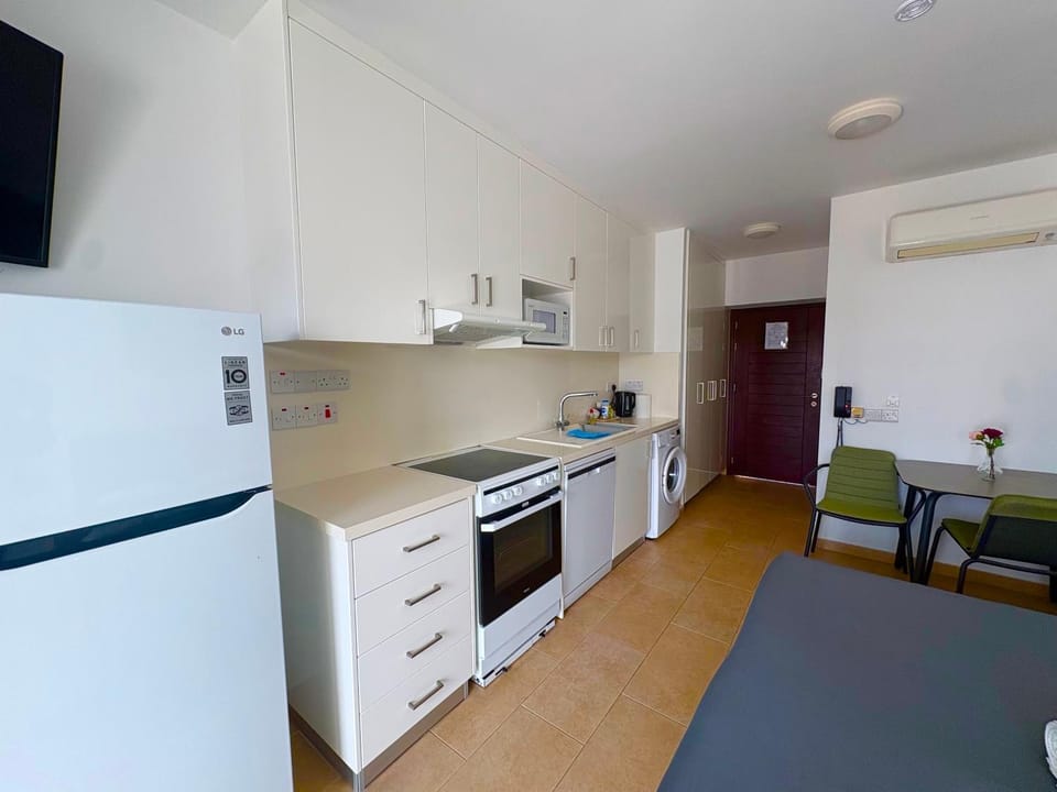 Kitchen or kitchenette, dishwasher, oven, stove