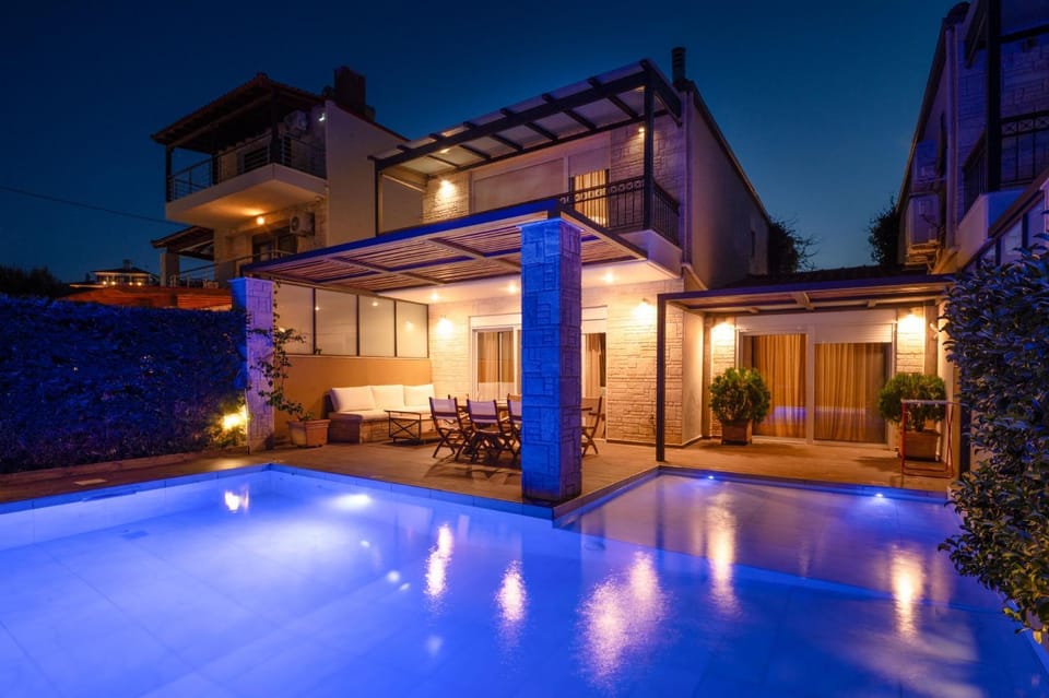 Property building, Patio, Night, Pool view, Swimming pool