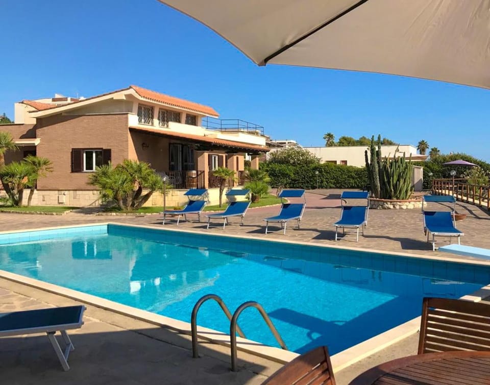 Property building, Patio, Day, Pool view, Swimming pool, sunbed
