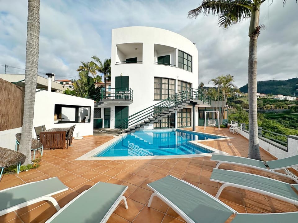 Property building, Patio, Mountain view, Swimming pool, sunbed