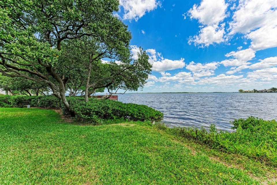 Blissfull Bay: Runaway Bay - Bayfront Condo! Largest Heated Pool by Anna Maria Life Vacation Rentals House in Bradenton Beach