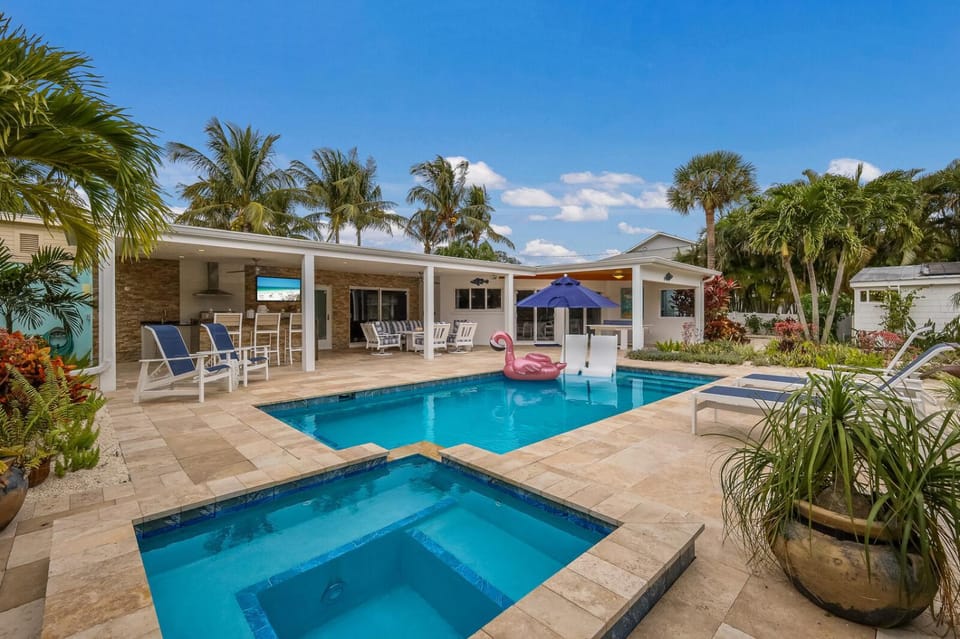 Canal Walk: Tiki Bar, Mini Golf, Pool & Spa On Canal by Anna Maria Life Vacation Rentals House in Holmes Beach