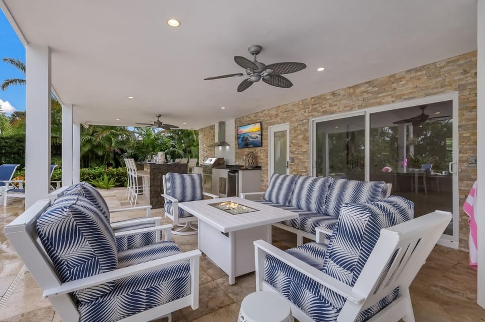 Canal Walk: Tiki Bar, Mini Golf, Pool & Spa On Canal by Anna Maria Life Vacation Rentals House in Holmes Beach