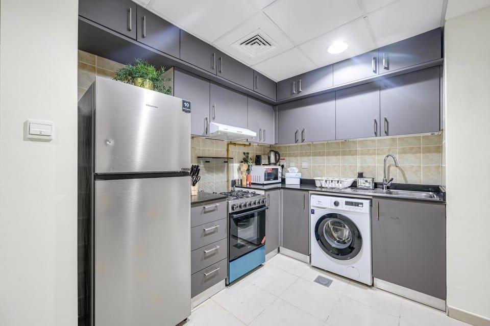 Kitchen or kitchenette, microwave, oven, stove