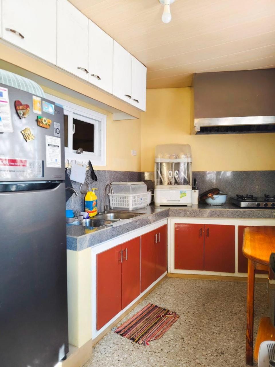 Kitchen or kitchenette, dishwasher, oven, stove