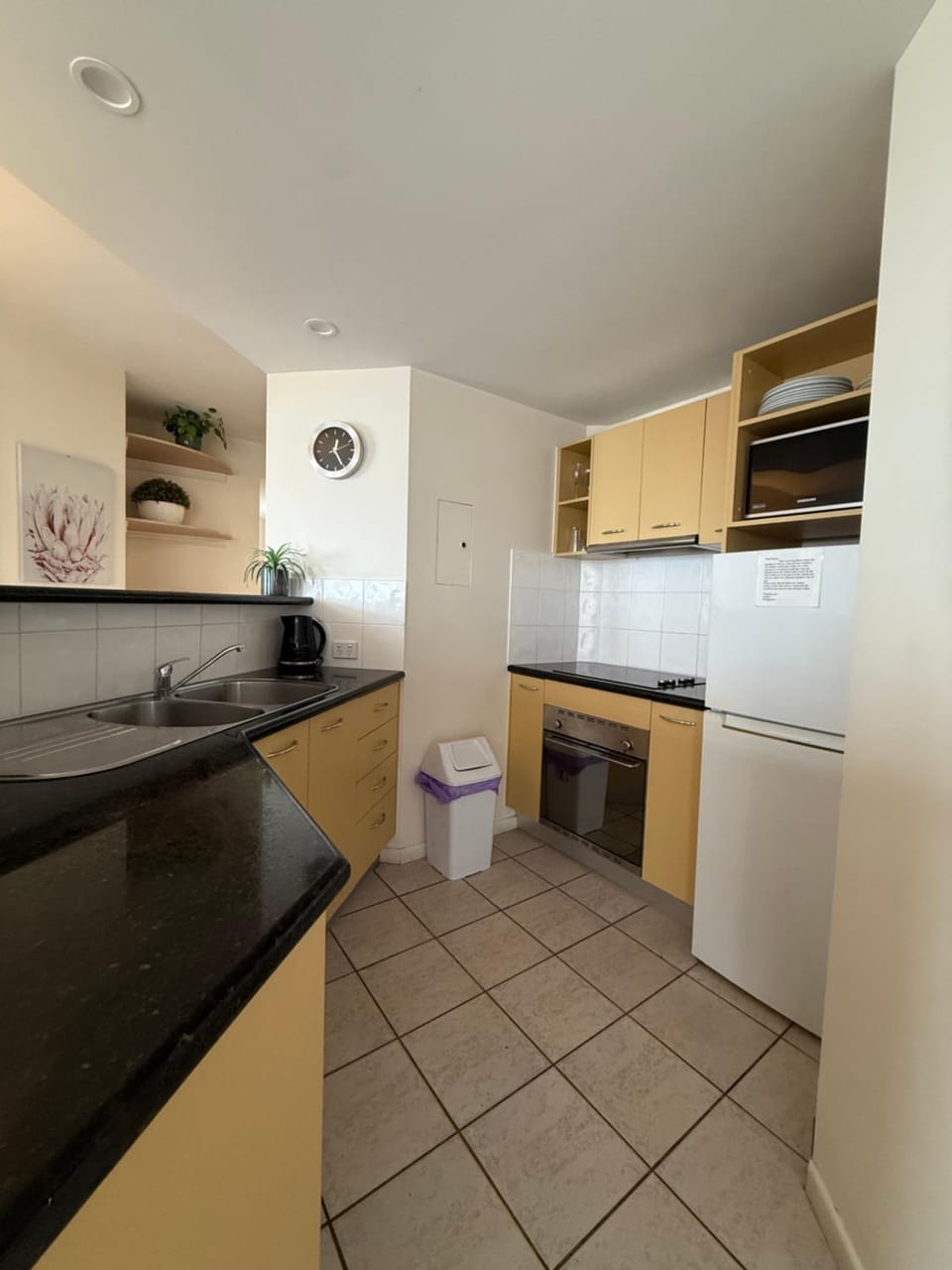 Kitchen or kitchenette, dishwasher, oven, stove