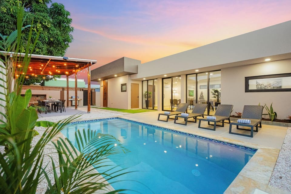 Property building, Patio, Pool view, Swimming pool, sunbed