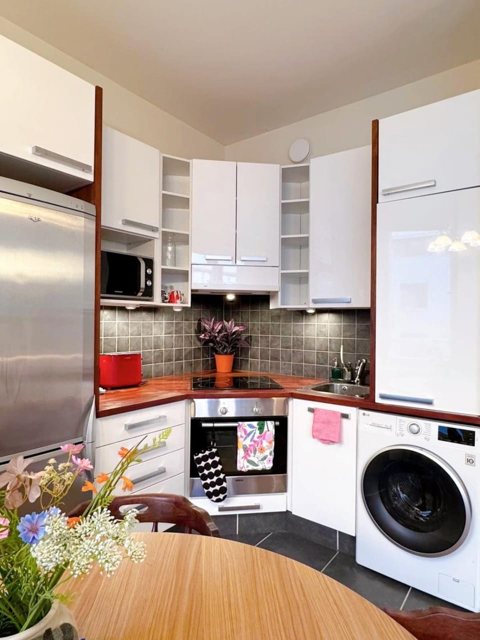 Kitchen or kitchenette, dishwasher, oven, stove, toaster, washing machine, dryer