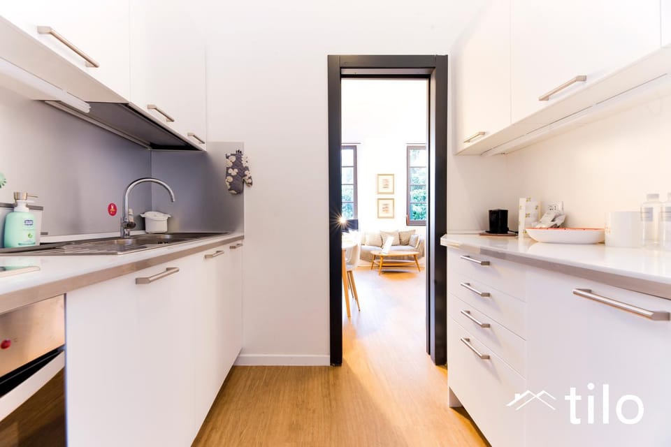 Kitchen or kitchenette, dishwasher, oven, stove