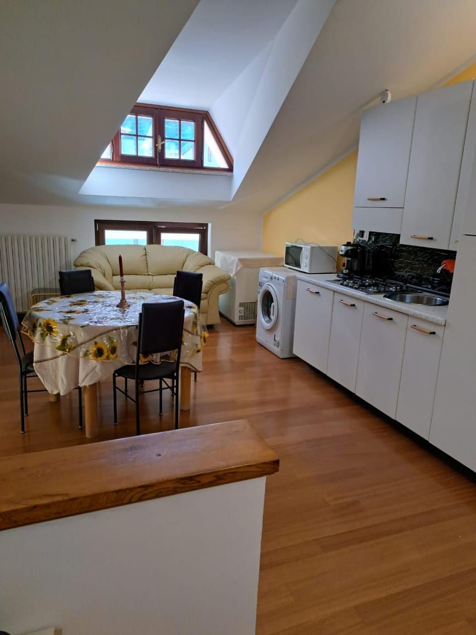 Dining area, microwave, washing machine, kitchen