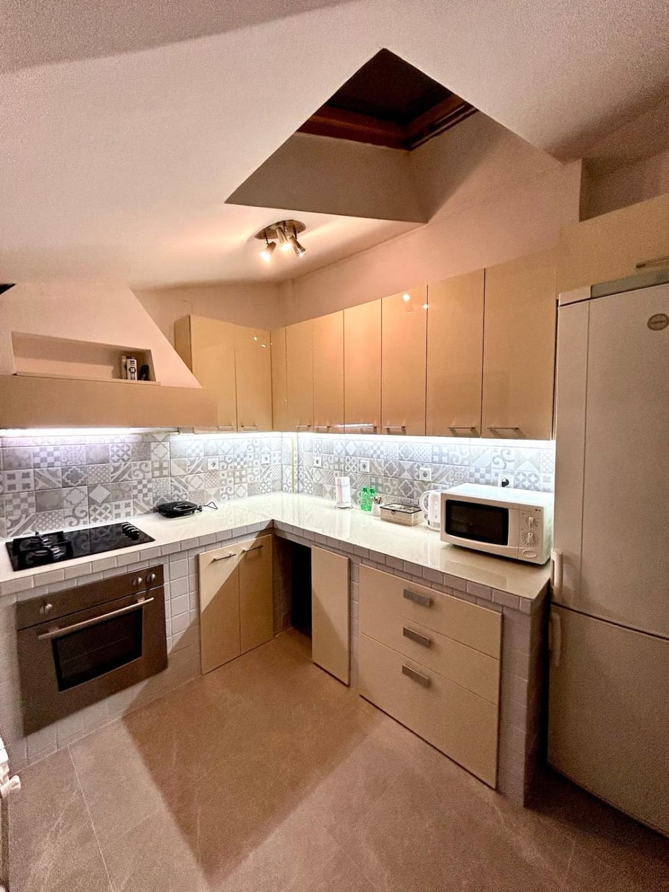Kitchen or kitchenette, dishwasher, oven, stove