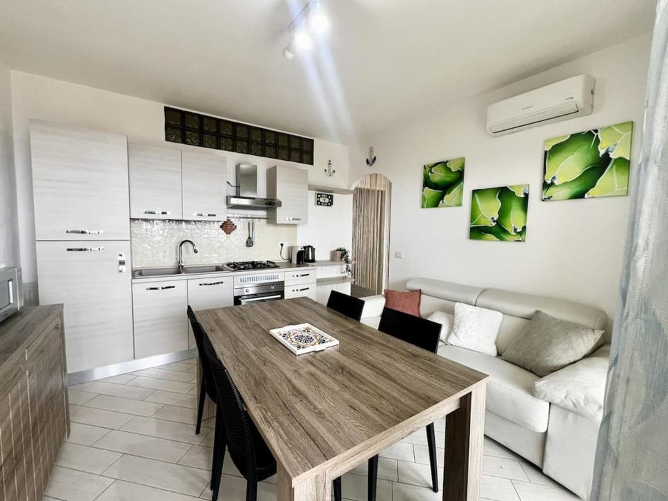 Kitchen or kitchenette, Seating area, Dining area, oven, stove, air conditioner