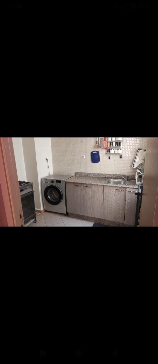 Kitchen or kitchenette, washing machine