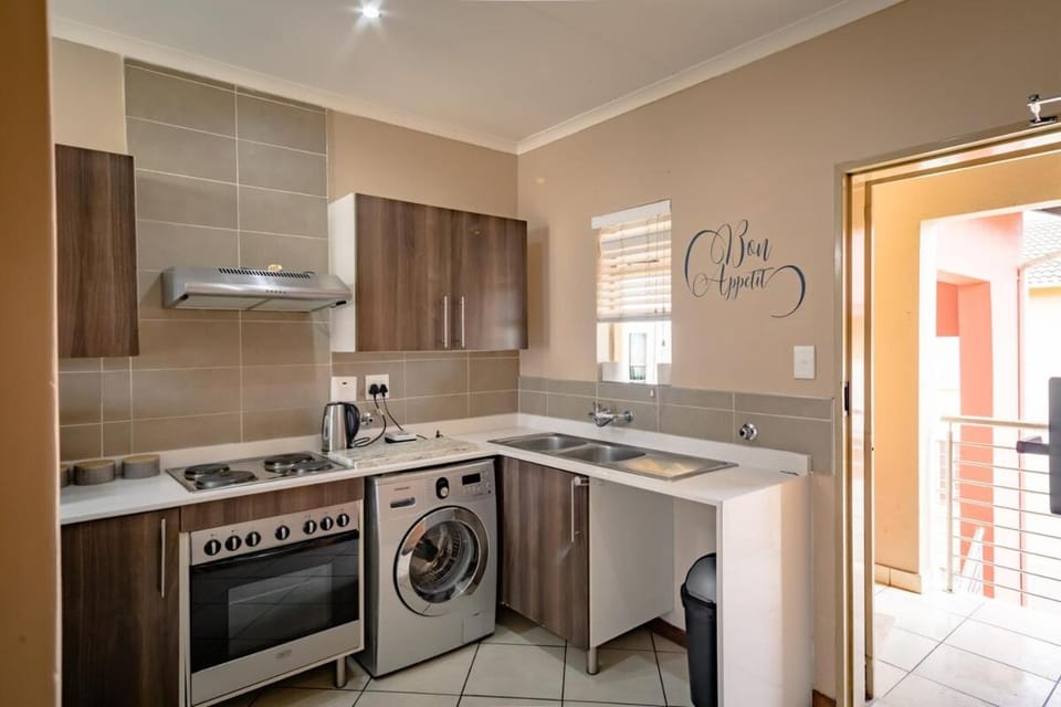 Kitchen or kitchenette, oven, stove, washing machine