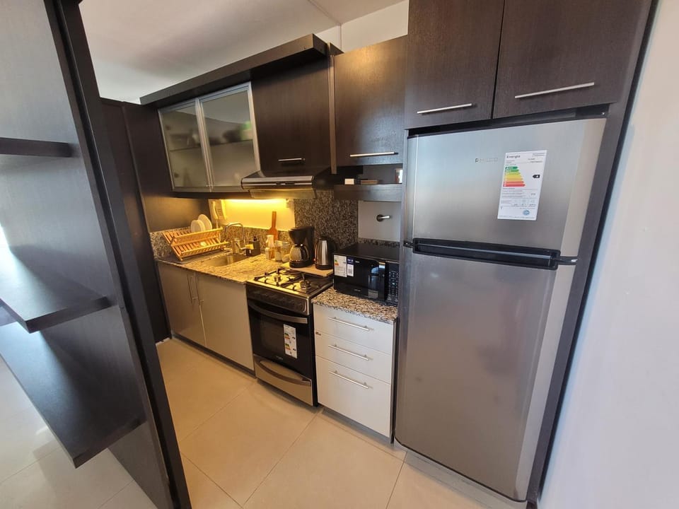 Kitchen or kitchenette, microwave, oven, stove