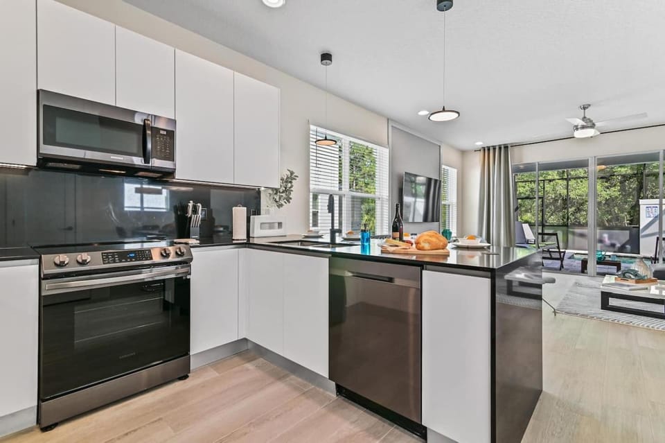 Kitchen or kitchenette, dishwasher, oven, stove