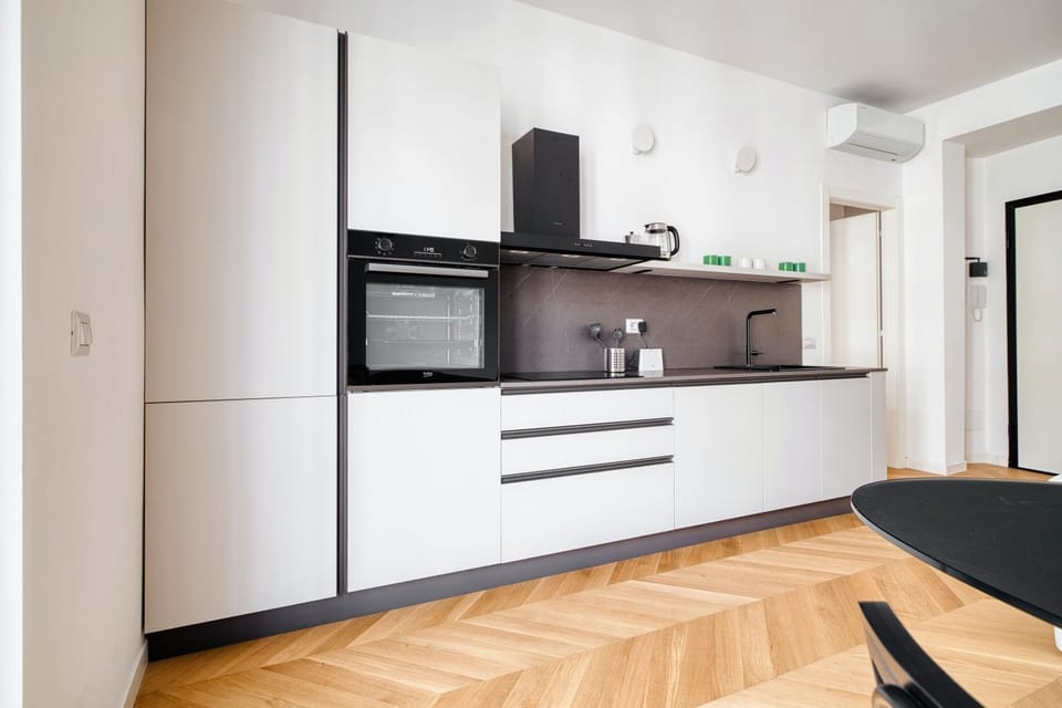 Kitchen or kitchenette, oven, stove, air conditioner
