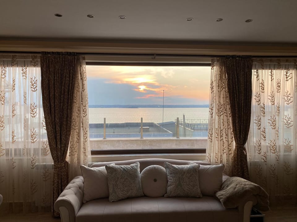 Living room, Seating area, Lake view, Sunset
