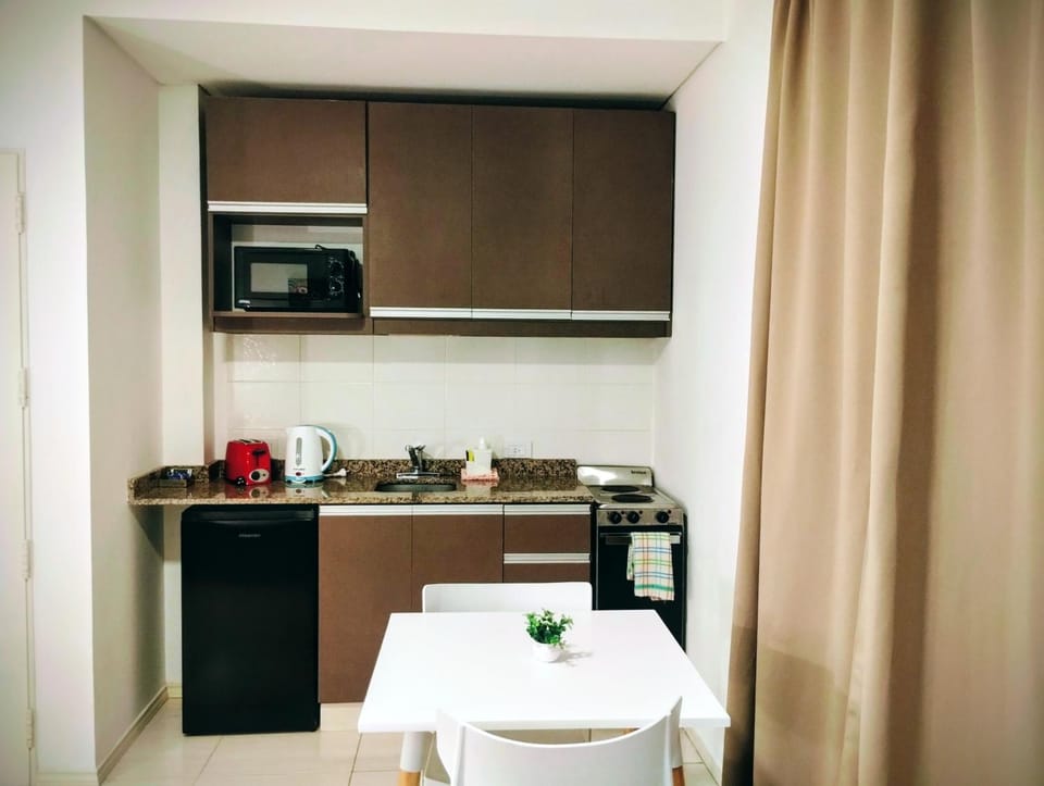 Kitchen or kitchenette, oven, stove, toaster