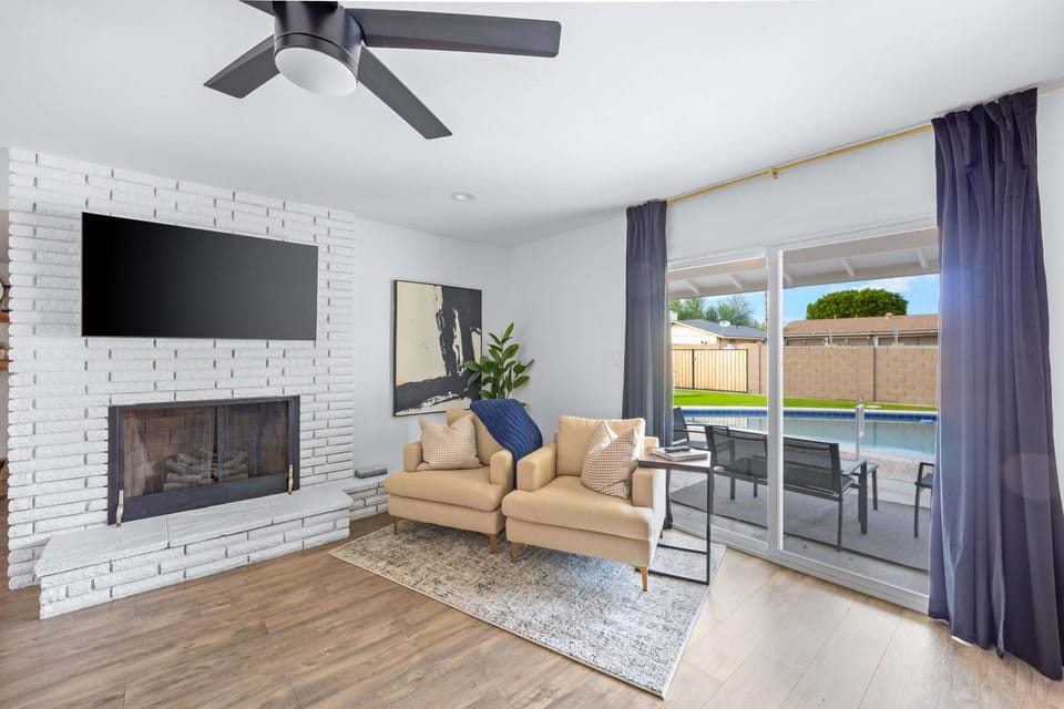TV and multimedia, Living room, Seating area, Pool view, fireplace
