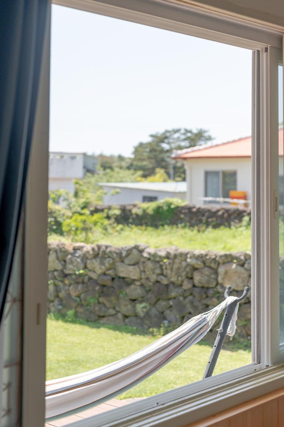 100 pyeong stone wall garden stay with the atmosphere of Jeju, Toto's sea House in South Korea